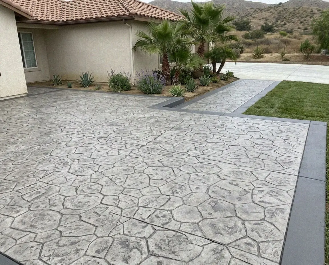 A stamped concrete patio and walkway at an Ontario, CA home